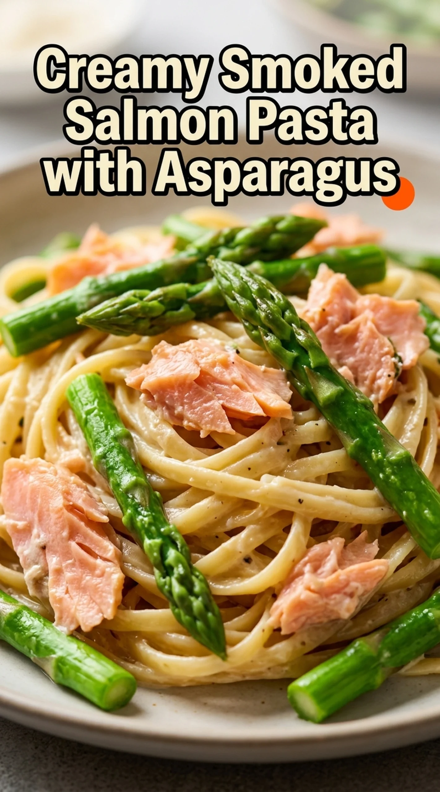 Creamy pasta with smoked salmon ribbons and sautéed asparagus tips in a white bowl, garnished with fresh dill.