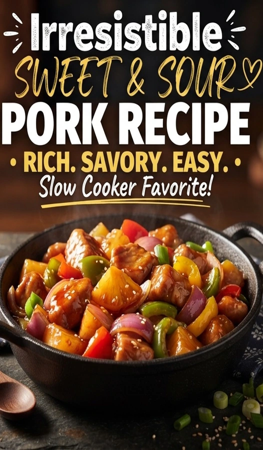Slow cooker sweet and sour pork with chunks of meat, pineapple, and bell peppers in a glossy red sauce.